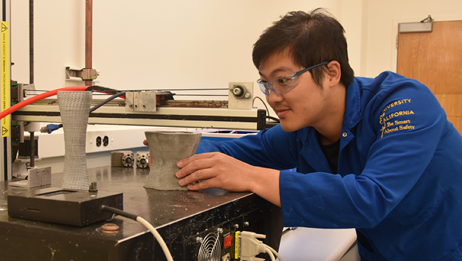 ICM man scientist working on a low-carbon 3D printed concrete element in the laboratory